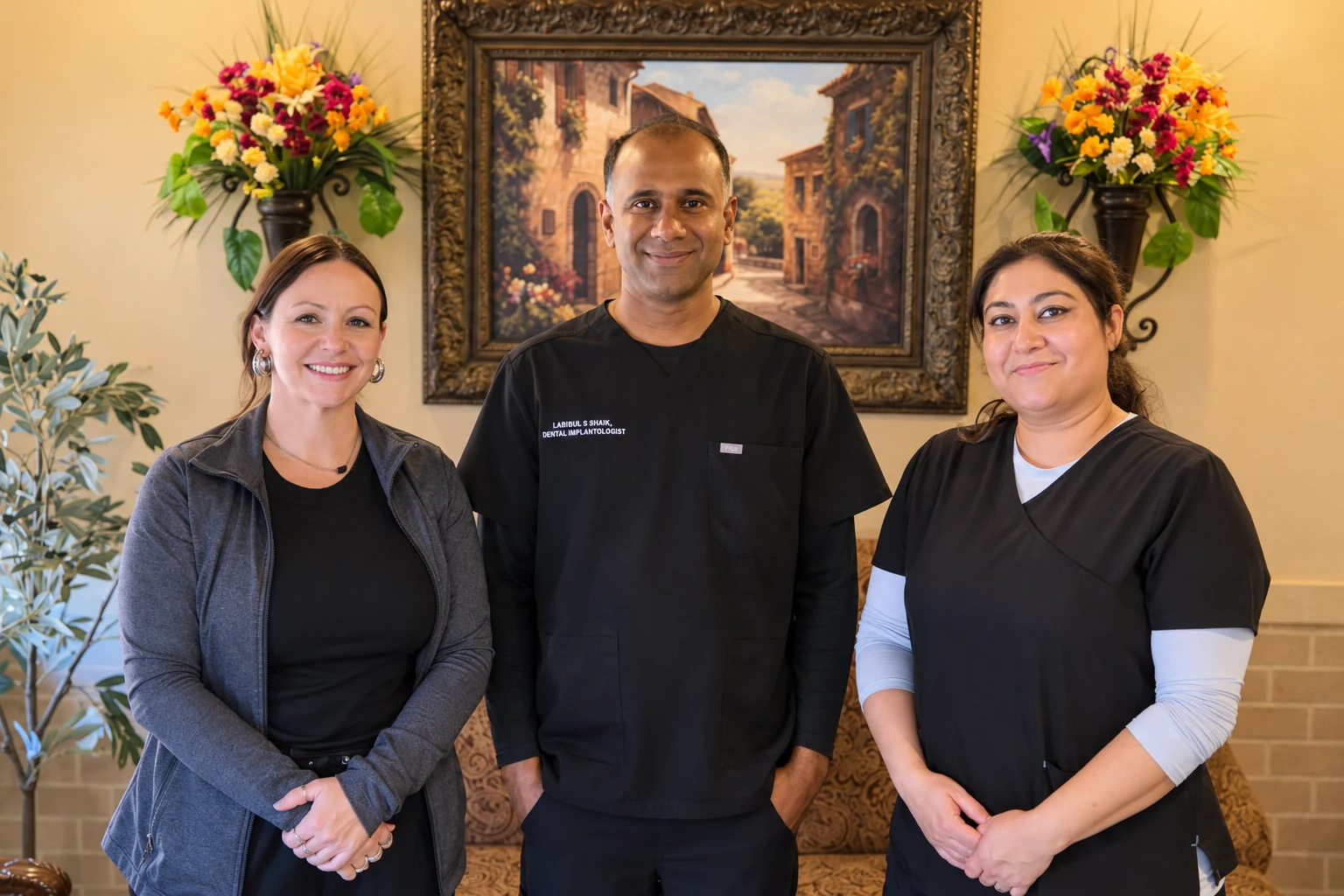 Dr. Krishna Adusumilli with members of the Lakehills Dental Center team.